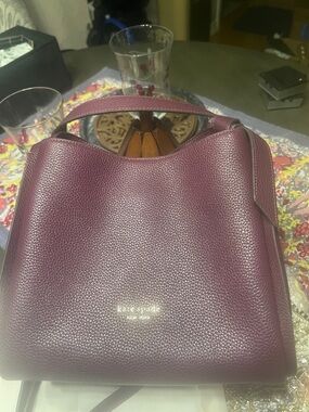 kate spade Pebbled Leather Carryall Bag in Deep Cherry.